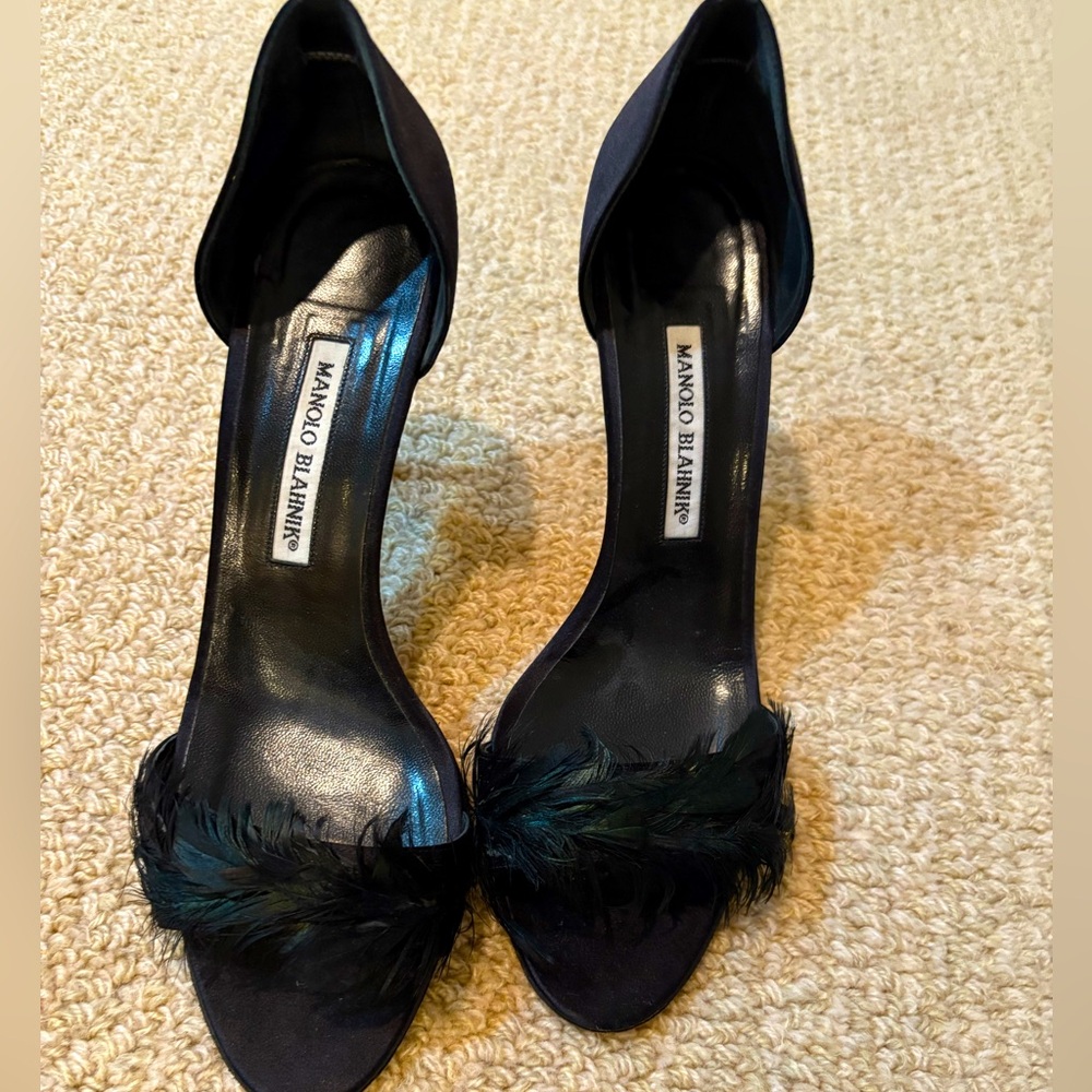 Manolo heels worn one time with feather detailing. These are basically new
